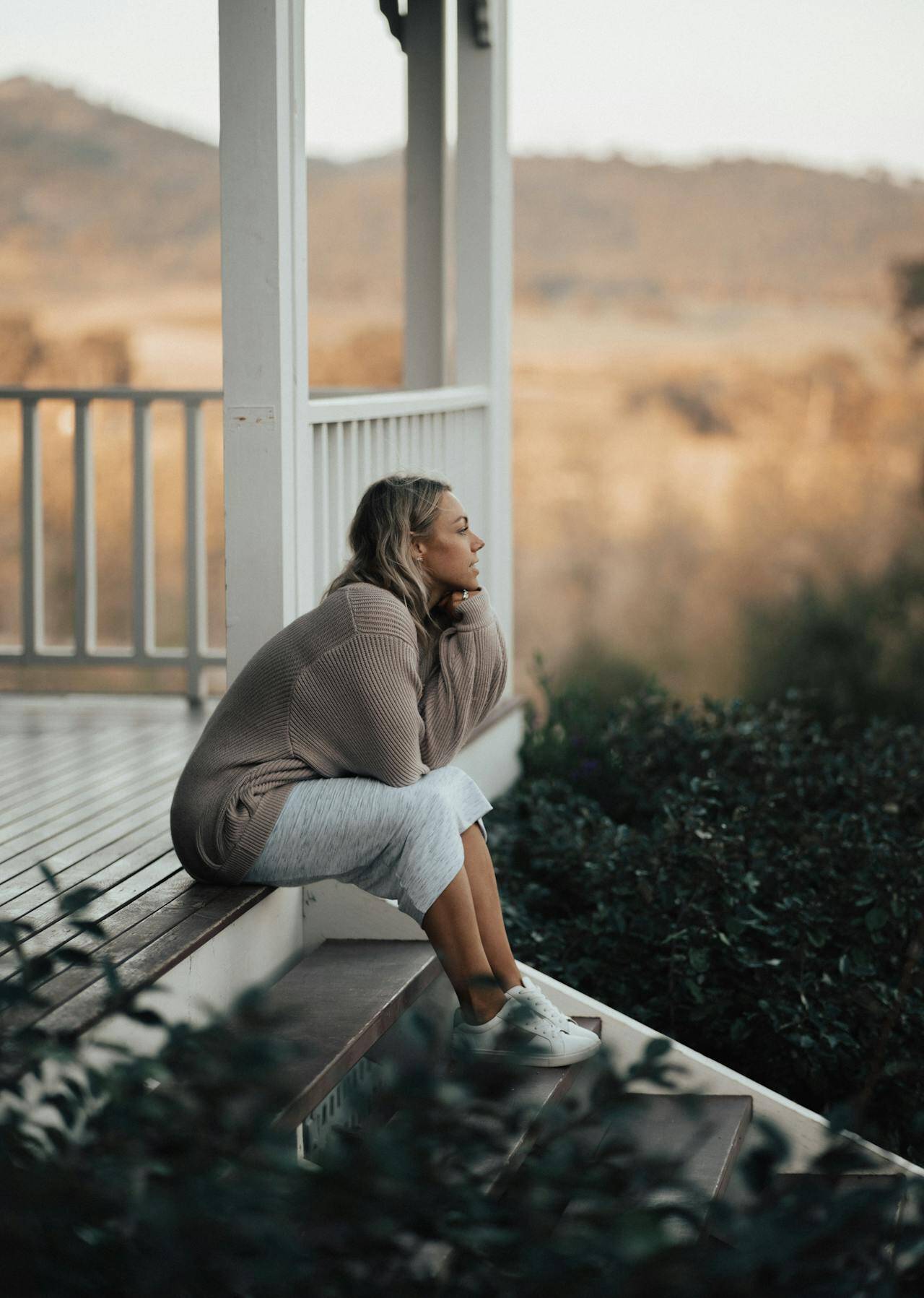 woman-gazing-on-her-porch-pexels-ben-mack-6775326